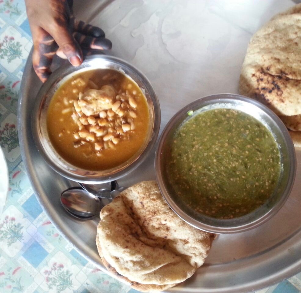 Baladi bread with beans and mulokhiya (jute mallow). Photo by Mariam Taher