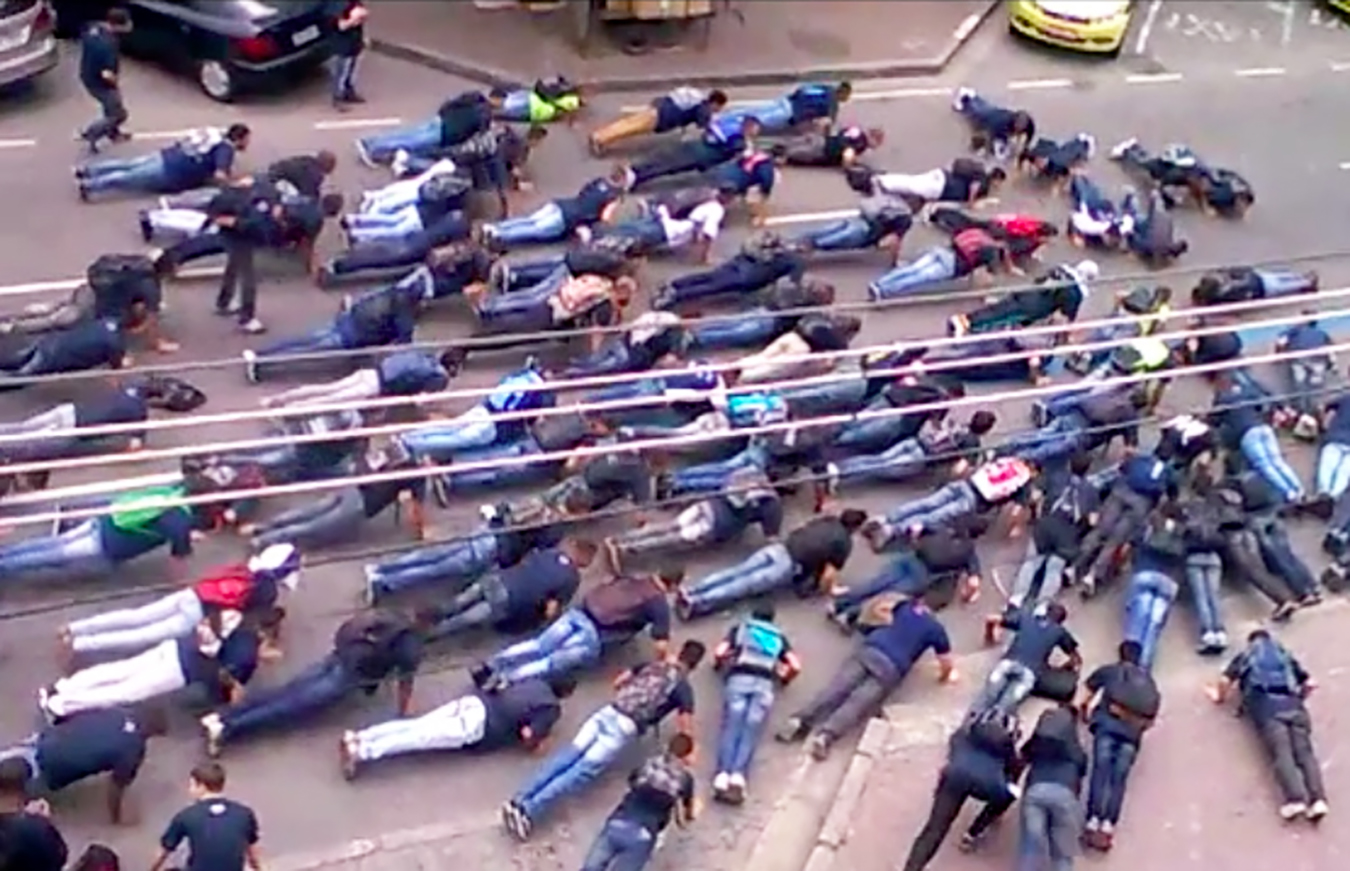 Students block rush hour traffic for pushups. Image by Benjamin Fogarty-Valenzuela.