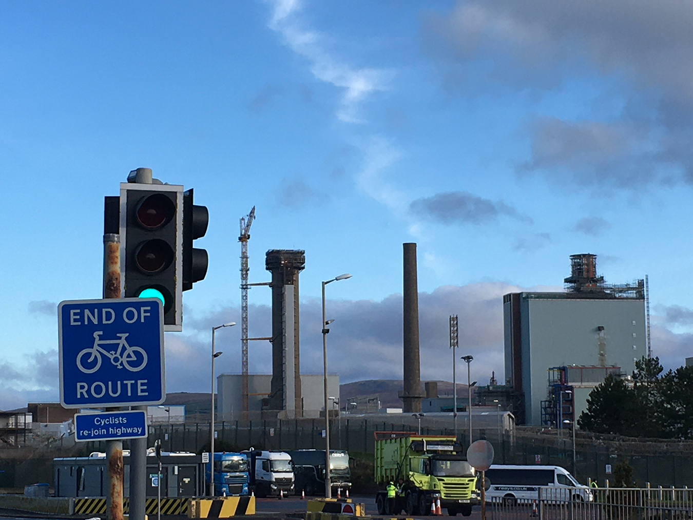Legacy facilities on Sellafield site in the process of being decommissioned, close to the main gate where trucks are inspected before they are allowed to enter the site, 2019. On the left (with the crane perched above it) is the Pile One chimney where the 1957 Windscale fire occurred. Photo by Petra Tjitske Kalshoven.