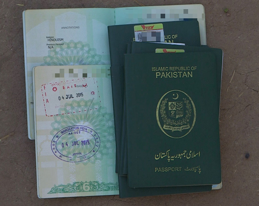 Migrant Passports and Immigration Stamps. Photo by Natasha Raheja.