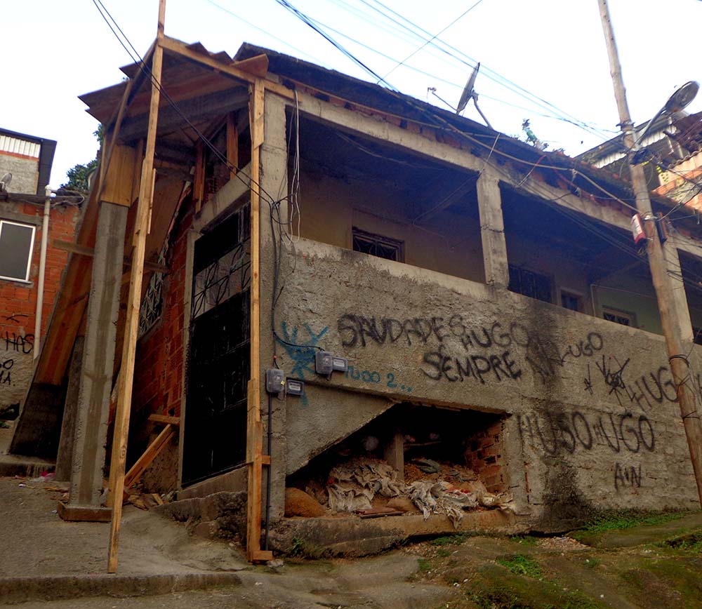 Graffiti mourning the death of a youth in a Rio de Janeiro favela. Photo by Eugênia Motta.
