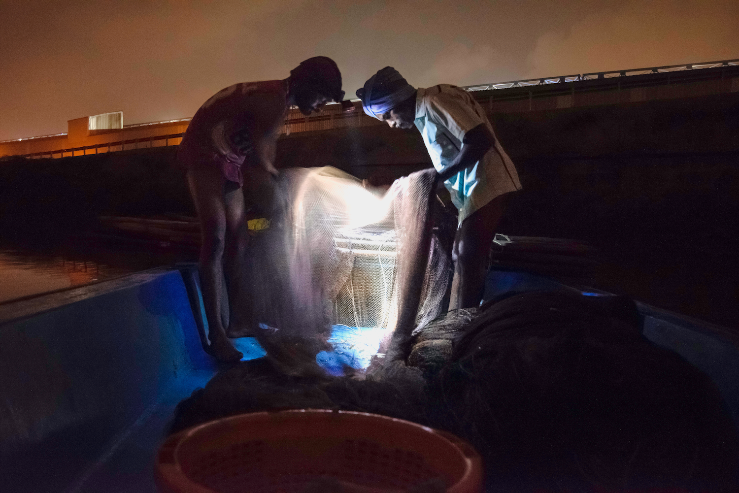 Surya and Velu inspecting their catch.