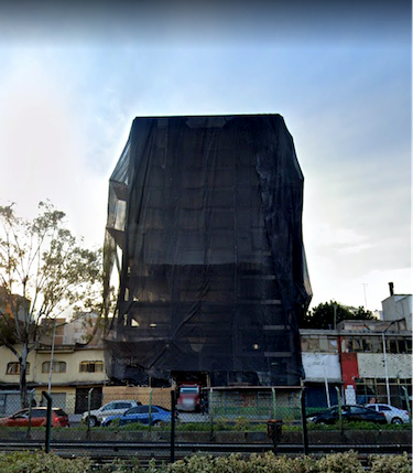 A collapsing building, shrouded in a black veil.