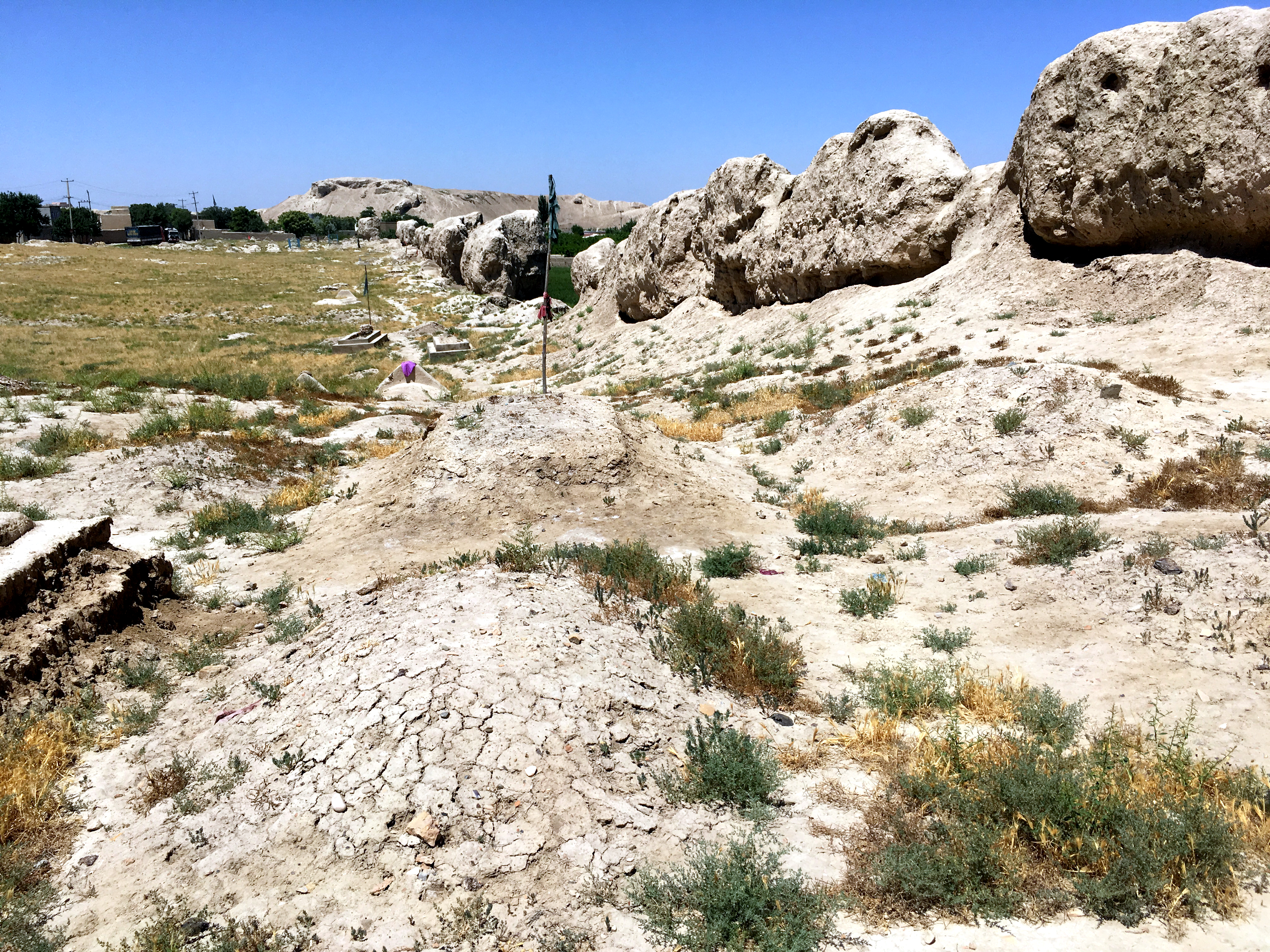 Mounds and graves along the old city wall of Balkh.