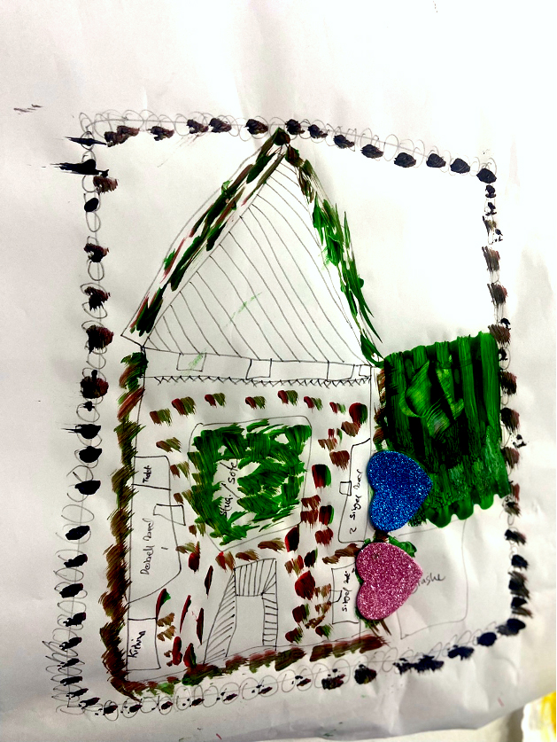 A hand painting of a home with glitter hearts.