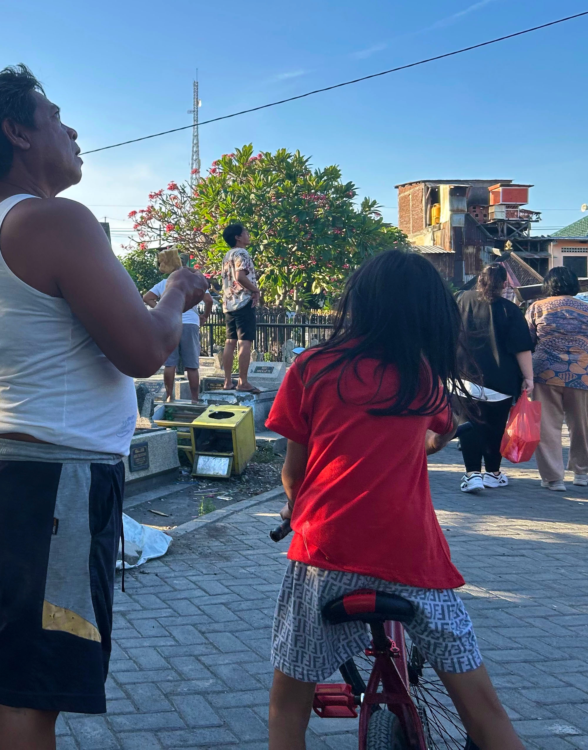 Men, women, and children at a pigeon race.